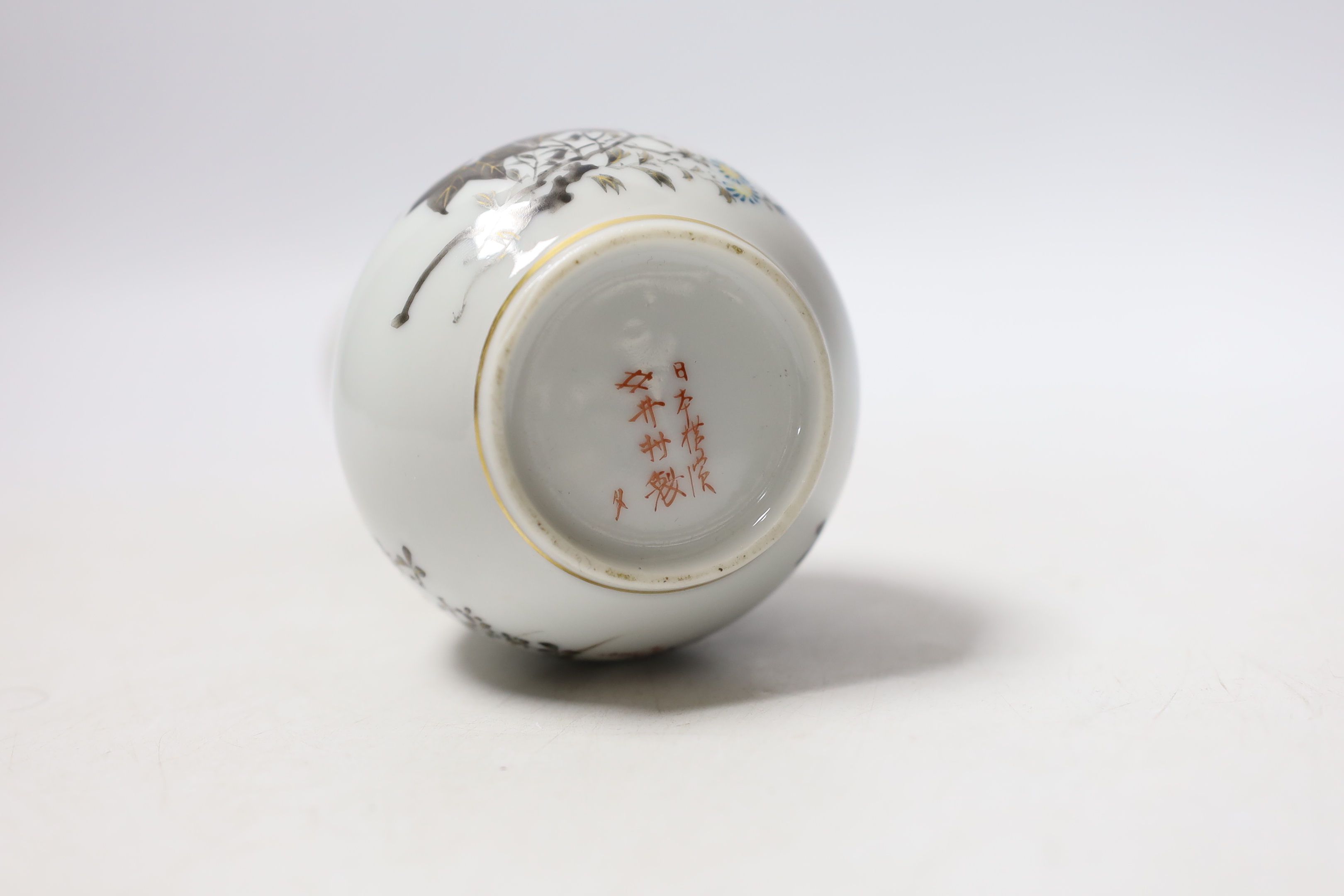 A Japanese bottle vase with lion mask and ring handles, together with a hardstone disc